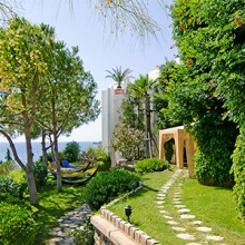 A garden walk overlooking the sea at the KoruMar Hotel