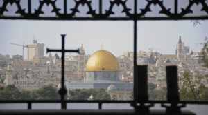 The city of Jerusalem seen through a window, facing Temple Mount on a Holy Land tour