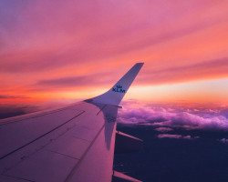 Plane Wing Pink and Purple Clouds Itinerary