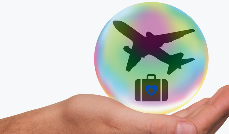 graphic hand holding bubble with silhouette of plane and suitcase icon