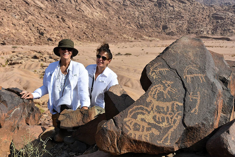 saudi arabia ladies with petroglyphs