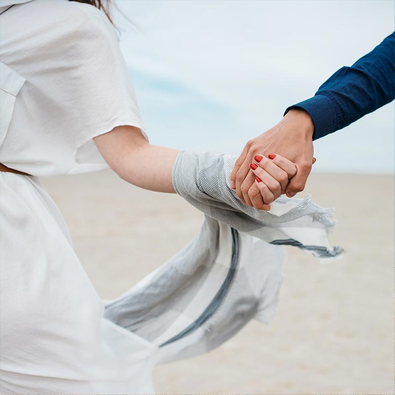 Christian Couple Holding Hands On Vacation