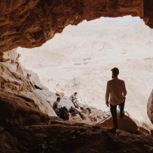 Christian Man standing at mouth of elijahs cave near mount sinai