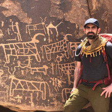 Joel Richardson In Front Of Petroglyphs on christian tour of saudi arabia real mount sinai thumbnail