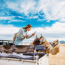 Taking a picture of a camel in Jordan