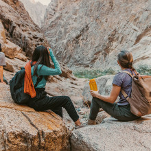 Three women hiking at Sheeab Musa – NEOM Saudi Arabia unsplash