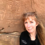 woman with saudi arabia stone inscriptions