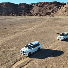 Drone Shot of tour vehicles in arabia Drone Shot of tour vehicles in arabia