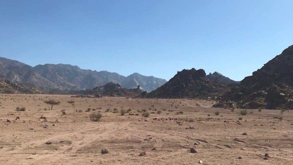 The parched desert of the valley of Rephidim, with mountains in view.