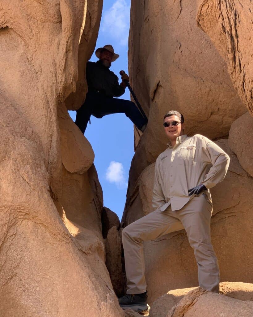 Standing in the Split Rock of Horeb Saudi Arabia Christian Tour