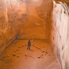 Eli Shukron Exploring Cave in Israel Featured