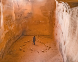 Eli Shukron Exploring Cave in Israel Featured